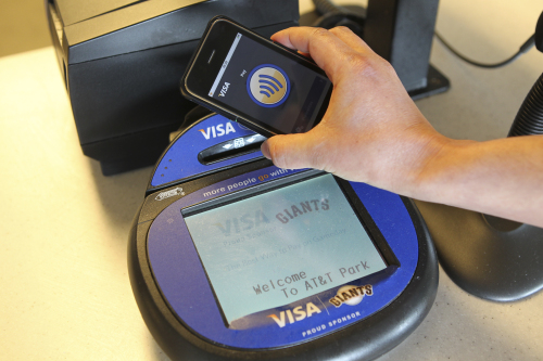 Visa Inc’s new contactless payment application, “Visa payWave,”
is demonstrated in this undated handout photo provided to the
media Friday. Bloomberg