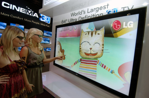 Product demonstrators watch LG Electronics’ 3-D television at this year’s Consumer Electronics Show in Las Vegas.    LG Electronics