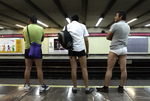People wait for a subway train without trousers during an event "No Pants Subway Ride" in Mexico City on Jan. 9, 2011. Participators who attend the event ride the Mexico City subway without trousers Sunday. This event that started in 2002 in 50 cities around the world stresses that everybody should "keep a straight face about it". (Xinhua-Yonhap News)
