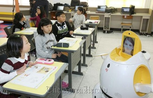Teaching robot Engkey stands in front of students at an elementary school in Daegu. AFP