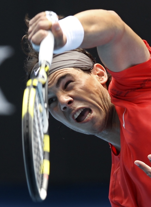 <YONHAP PHOTO-0981> Spain's Rafael Nadal serves to Brazil's Marcos Daniel during their first round match at the Australian Open tennis championships in Melbourne, Australia, Tuesday, Jan. 18, 2011. (AP Photo/Mark Baker)/2011-01-18 12:11:43/ <저작권자 ⓒ 1980-2011 ㈜연합뉴스. 무단 전재 재배포 금지.>
Rafael Nadal serves against Marcos Daniel at the Australian Open.  AP-Yonhap News