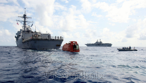 The guided-missile destroyer USS Bainbridge (DDG 96) tows the lifeboat from the Maersk Alabama in the Indian Ocean.
Bloomberg