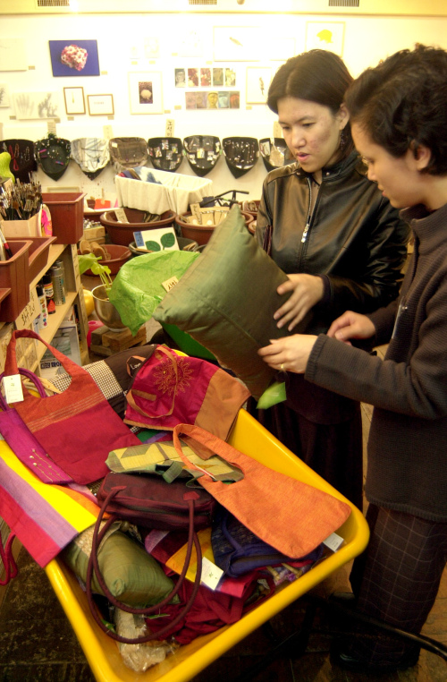 Visitors take a look at goods at a Beautiful Store shop in Seoul.   Korea Herald file photo