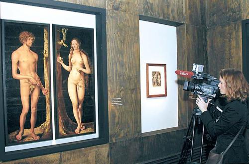 The painting “Adam and Eve” is filmed during the opening of “Cranach and His Time,” a new exhibition
at Musee du Luxembourg in Paris, Monday. (AP-Yonhap News)