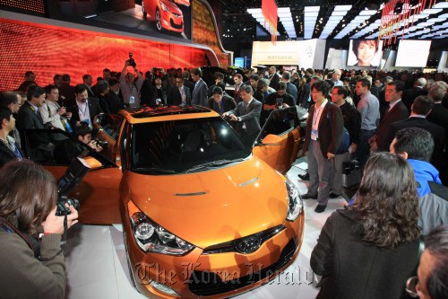 Visitors view the Veloster at the North American International Auto Show in Detroit in January.  Hyundai Motor Co.