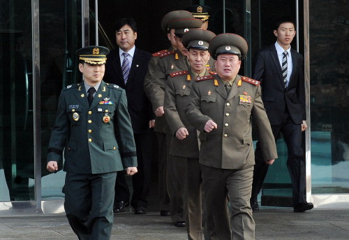 Colonel Ri Son-Kwon (front R) of the Democratic People's Republic of Korea (DPRK) and Colonel Moon Sang-gyun (L) of the Republic of Korea's (ROK) enter the venue of the inter-Korean military talks at the truce village of Panmunjom, Feb. 8, 2011. The Republic of Korea (ROK) and the Democratic People 's Republic of Korea (DPRK) held working-level military talks at the truce village of Panmunjom on Tuesday. (Xinhua/South Korean Defense Ministry)