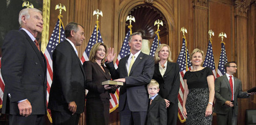 Rep. Christopher Lee, R-N.Y., fourth from right, with members of his family, at a swearing-in ceremony last month. (Jacquelyn Martin/ AP)