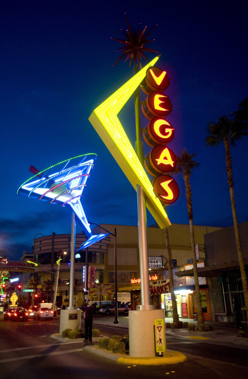 A martini glass and Vegas
neon signs glow against the
evening sky in the Fremont
East District along Fremont
Street in downtown in Las
Vegas.
(Orange County Register/MCT)