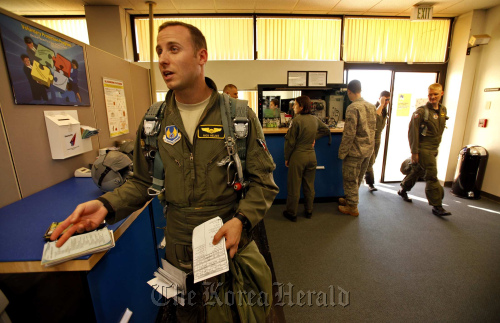 Air Force Captain Pilot Nick “Hammer” Helms returns from his one hour training flight aboard a T-38.
Los Angeles Times/MCT