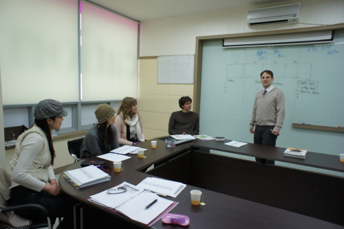 Jason Fowler holds a seminar for a new school that will open next week in Daegu. Whiz Education