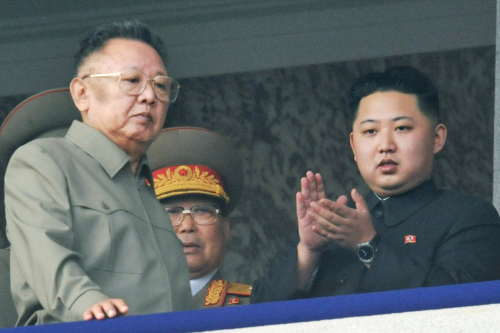 North Korean leader Kim Jong-il and his son Jong-un attend a ceremony marking the 65th founding anniversary of the Workers’ Party in Pyongyang on Oct. 10. (Yonhap News)