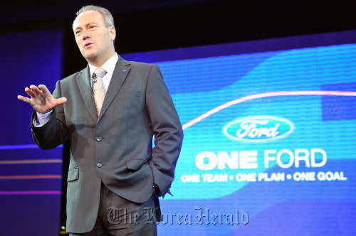 Stephen Odell, chief executive officer of Ford Europe, gestures while speaking prior to the start of the Paris Motor Show in Paris.  Bloomberg