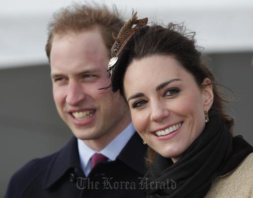 Britain’s Prince William and his fiance Kate Middleton at a naming ceremony and service dedication for the Royal National Lifeboat Institution’s new Atlantic 85 Lifeboat, at Trearddur Bay Lifeboat Station in Anglesey, Wales, Thursday. AP-Yonhap News