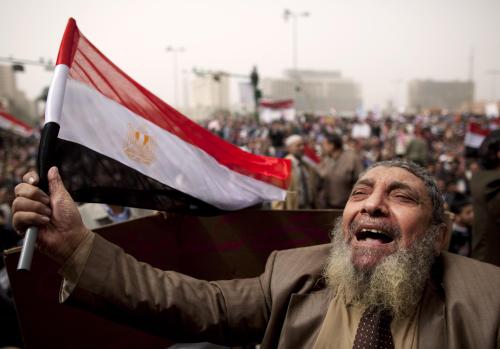 <YONHAP PHOTO-0434> An Egyptian protester chants slogans at a rally demanding Libyan leader Moammar Gadhafi step down during demonstrations in Tahrir Square in Cairo, Egypt, Friday, Feb. 25, 2011. Militias loyal to Moammar Gadhafi opened fire on protesters streaming out of mosques in the Libyan capital on Friday, demanding the regime's ouster, witnesses said, reporting at least four killed. Across rebellious cities in the east, tens of thousands held rallies in support of the first Tripoli protests in days.(AP Photo/Kevin Frayer)/2011-02-26 05:22:49/ <저작권자 ⓒ 1980-2011 ㈜연합뉴스. 무단 전재 재배포 금지.>
An Egyptian protester chants slogans at a rally demanding Libyan leader Moammar Gadhafi step down during demonstrations in Tahrir Square in Cairo, Friday.  AP-Yonhap News