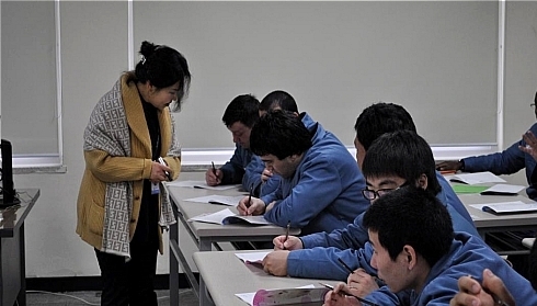 Inmates take a Korean language lesson at the Cheonan Foreigner Prison.