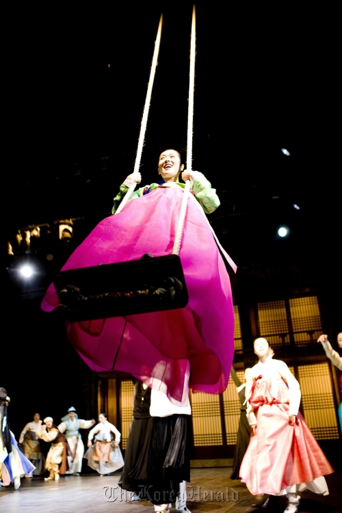Chunhyang rides a swing during scene one, “Dano Festival,” from the performance of “Miso.” Chongdong Theater