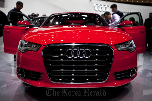 The 2012 Audi AG A6 sedan sits on stage following its unveiling at the North American International Auto Show in Detroit, Michigan. Bloomberg
