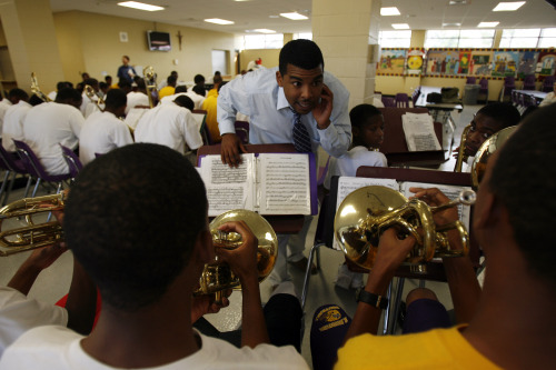 Director's assistant Tommy Curtain conducts practice of the St. Augustine High School marching band at school's cafeteria in New Orleans, Louisiana. (MCT)