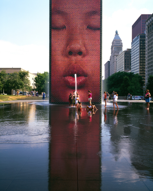 Children play in front of the “Crown Fountain” in Chicago,
Illinois. The Spring
