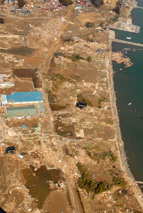 In a March 13, 2011 photo provided by Navy Visual News Service, An aerial view of tsunami damage in an area north of Sendai, Japan, taken from a U.S. Navy helicopter assigned to the aircraft carrier USS Ronald Reagan. The Ronald Reagan is off the coast of Japan rendering humanitarian assistance following the 8.9 magnitude earthquake and tsunami. (AP-Yonhap News)