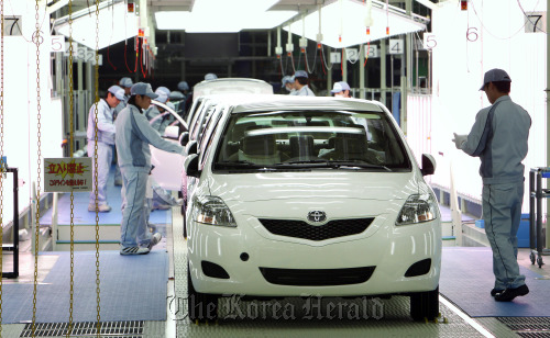 Workers make a final inspection of Toyota Motor Corp. Yaris vehicles on the production line of Central Motor Co.’s Miyagi plant in Ohira Village, Miyagi Prefecture, Japan.  Bloomberg
Workers make a final inspection of Toyota Motor Corp. Yaris vehicles on the production line of Central Motor Co.’s Miyagi plant in Ohira Village, Miyagi Prefecture, Japan.  Bloomberg