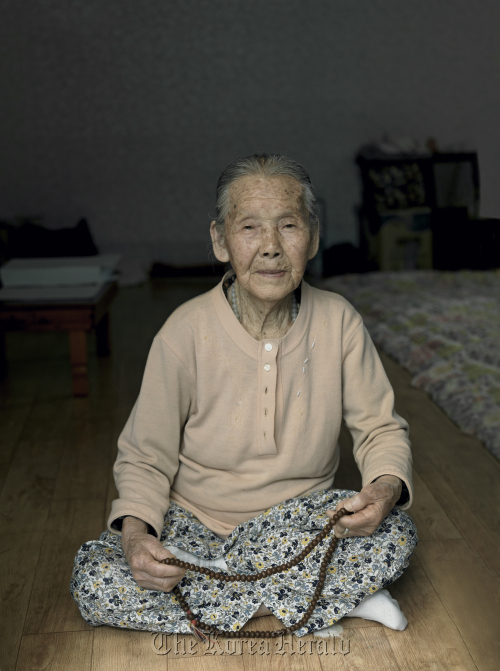 From left: “Park Weayeon, Age 101, She Lost Her Son during Korean War,” “A Letter to Mother” and “A Steel Helmet” by Koo Bohn-chang. Leeum, Samsung Museum of Art