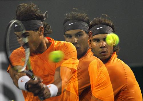 <YONHAP PHOTO-1343> MULTIEXPOSURES- Rafael Nadal of Spain returns the ball during his match against Somdev Devvarman of India during the Masters 1000 tournament in Indian Wells, California on March 16, 2011. AFP PHOTO / GABRIEL BOUYS /2011-03-17 12:53:49/ <저작권자 ⓒ 1980-2011 ㈜연합뉴스. 무단 전재 재배포 금지.>
Rafael Nadal returns a shot against Somdev Devvarman.  AFP-Yonhap News