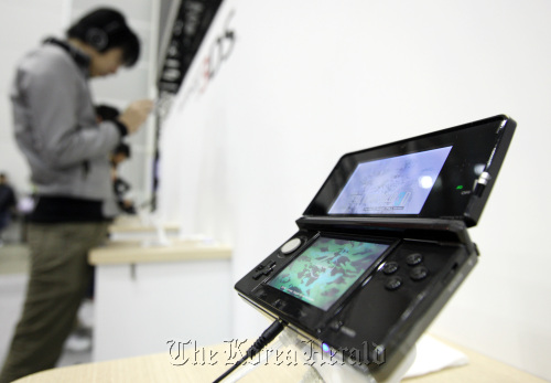 Nintendo Co.’s 3DS handheld player at Nintendo World 2011, an introductory event for the 3DS, in Chiba.  Bloomberg