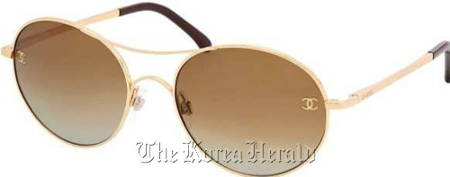 Chanel is making a gold metal pair ($290) of Lennon style sunglasses, but they’re not so perfectly round. They’re a cross between an aviator and a round shape, with amber colored lenses that will look chic through summer.  MCT