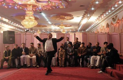 <YONHAP PHOTO-1637> TO GO WITH AFP STORY BY USMAN SHARIFI Lifestyle-Afghanistan-marriage-economy In this picture taken on March 9, 2011, young Afghan men dance during wedding celebrations at a wedding hall in Kabul. As a civil servant, Afghan Ahmad Mahfooz earns nearly 10 times the average annual salary in his impoverished homeland, but he still cannot afford to marry his fiancee. Already thousands of dollars in debt after hosting a lavish engagement party for 500 guests in December, Mahfooz says he doesn't know how he will ever afford the kind of wedding his wife-to-be and her family expect. AFP PHOTO/SHAH Marai /2011-04-08 12:44:30/ <저작권자 ⓒ 1980-2011 ㈜연합뉴스. 무단 전재 재배포 금지.>
An Afghan man dances during wedding celebrations at a wedding hall in Kabul.   AFP-Yonhap News