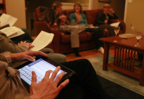 Allegra Petras types notes on her iPad during the Parents’ Club of
Palo Alto and Menlo Park book club meeting in Stanford,
California. (Nhat V. Meyer/San Jose Mercury News/MCT)