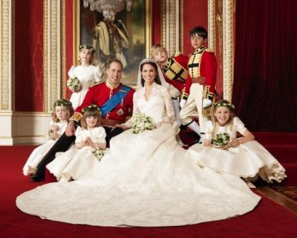 In this photo provided by Clarence House on Saturday, April 30, 2011, Britain's Prince William, center left, and his wife Kate, Duchess of Cambridge, center right, pose for a photograph with, clockwise from bottom right, Margarita Armstrong-Jones, Eliza Lopes, Grace van Cutsem, Lady Louise Windsor, Tom Pettifer, and William Lowther-Pinkerton in the Throne Room at Buckingham Palace, following their wedding at Westminster Abbey, London, on Friday, April 29, 2011. (AP)
