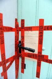 This photo taken on May 2, 2011 shows the taped up door to the home of Nathalie De May, a woman suspected of killing her newborn baby, in Limoux. (AFP-Yonhap News)