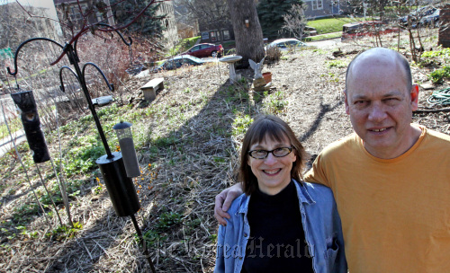 Susan (left) and Paul Damon stand on their landscaped no-grass lawn at their St. Paul, Minnesota home.  Minneapolis Star Tribune/MCT
