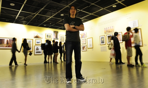 Kim Sang-jin at the exhibition “Dreams Come True: The Art of Disney’s Classic Fairy Tales” which is under way at Seoul Arts Center’s Hangaram Design Museum.  Park Hae-mook/The Korea Herald