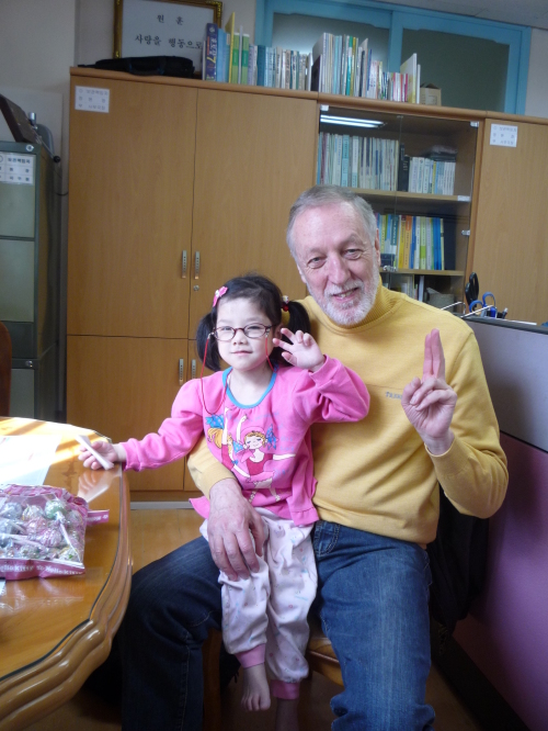 Terry Lyons with orphan Esther Park ahead of walking a marathon to raise cash for her expensive medication