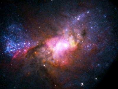 This NASA illustration photo shows stars that are forming in a dwarf starburst galaxy located about 30 million light years from Earth. A 22-year-old Australian university student has solved a problem which has puzzled astrophysicists for decades, discovering part of the so-called "missing mass" of the universe during her summer break. (NASA)