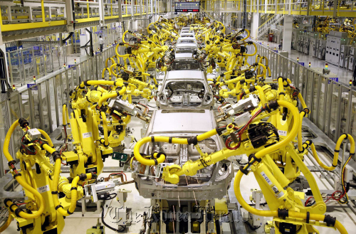 Industrial robots produced by Hyundai Heavy Industries are in operation at Kia Motors Corp.’s plant in Zilina, Slovakia. Hyundai Heavy Industries