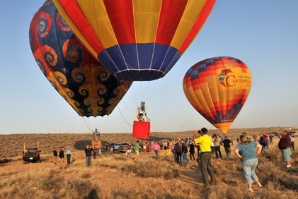 With a crowd of family and friends cheering him on, Bobby Bradley, 9, launches his hot air balloon for his first solo flight near Tome, Ariz. on Saturday, June 4, 2011. Nine-year-old Bobby Bradley floated into history early Saturday, taking off solo in a hot air balloon and landing perfectly about a half-hour later to become the youngest trained pilot to accomplish such a feat. (AP)