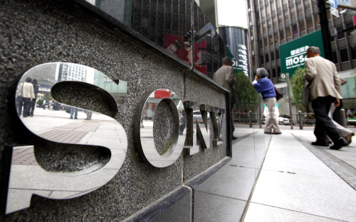 People walk by Sony Building in Tokyo's Ginza shopping district in Tokyo. Another massive data breach at Sony has left hackers exulting, customers steaming and security experts questioning why basic fixes haven't been made to the company's stricken cybersecurity program. (AP-Yonhap News)