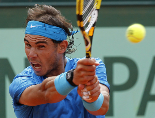 <YONHAP PHOTO-0112> Spain's Rafael Nadal returns the ball to Switzerland's Roger Federer during the men's final match for the French Open tennis tournament at the Roland Garros stadium, Sunday, June 5, 2011, in Paris. (AP Photo/Lionel Cironneau)/2011-06-06 01:17:12/ <저작권자 ⓒ 1980-2011 ㈜연합뉴스. 무단 전재 재배포 금지.>
Rafael Nadal’s six French Open trophies now sit alongside two from Wimbledon and one apiece from the U.S. Open and Australian Open.
AP-Yonhap News