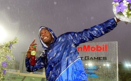 Usain Bolt of Jamaica makes his characteristic pose after winning the 200m at the Diamond league Bislett Games in Olso, Norway Thursday June 9 2011. Bolt clocked the year's fastest time of 19.86 seconds in rainy conditions. (AP)