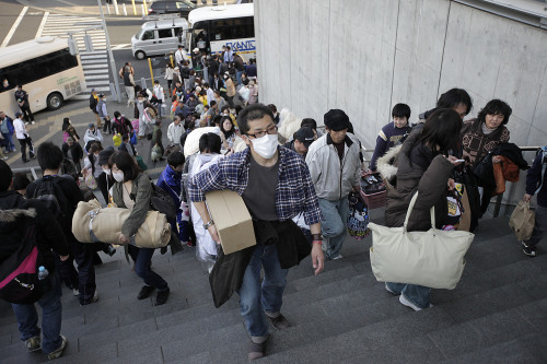 In this Saturday, March 19, 2011 file picture, evacuees from Futaba, a town near the tsunami-crippled Fukushima Dai-ichi nuclear plant in Fukushima Prefecture, arrive at their new evacuation shelter at the Saitama Super Arena in Saitama, near Tokyo. (AP-Yonhap News)