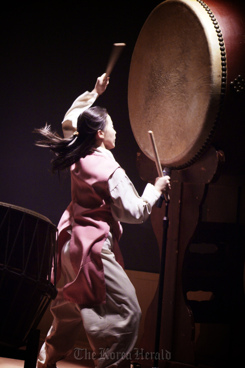 A Korean percussionist plays the big traditional Korean drum during a live samulnori performance the foundational ensemble style at the heart of gugak Korean traditional music
