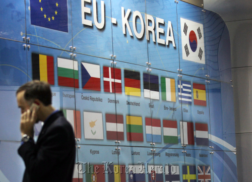 A glass board inscribed with the national flags of Korea and EU member-countries stands in a fair to mark the ratification of the Korea-EU FTA in Seoul in March.   Yonhap News
A glass board inscribed with the national flags of Korea and EU member-countries stands in a fair to mark the ratification of the Korea-EU FTA in Seoul in March.   Yonhap News
