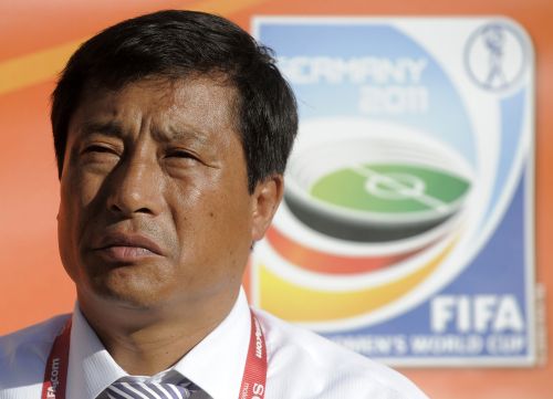 <YONHAP PHOTO-0715> North Korea's head coach Kim Kwang Min looks on prior to the football match of the FIFA women's football World Cup USA vs Korea PRK (group C) at Dresden's Gluecksgas stadium, eastern Germany, on June 28, 2011. USA won the match 2-0. AFP PHOTO / ROBERT MICHAEL /2011-06-29 07:45:09/ <저작권자 ⓒ 1980-2011 ㈜연합뉴스. 무단 전재 재배포 금지.>
North Korea’s head coach Kim Kwang-min.  AFP-Yonhap News