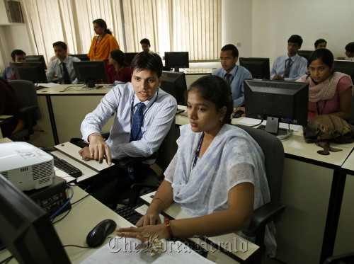 Engineering recruits undergo training at the Tata Consultancy Services Ltd. training center in Trivandrum, India, on May 24.  Bloomberg