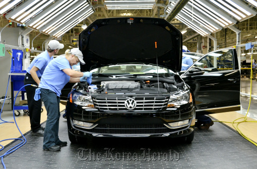 Line inspection workers check out a Volkswagen AG 2012 Passat at the company’s factory in Chattanooga, Tennessee.  Bloomberg