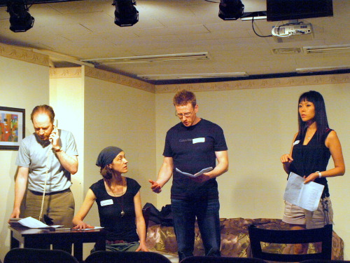 Expats thrash out a play during July’s Play in a Day event.  Michele Farley