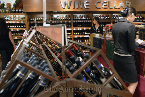 Bottles of wine are arranged at a wine shop in Seoul.    Bloomberg